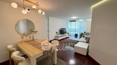 Spacious living and dining area with modern decor and natural light