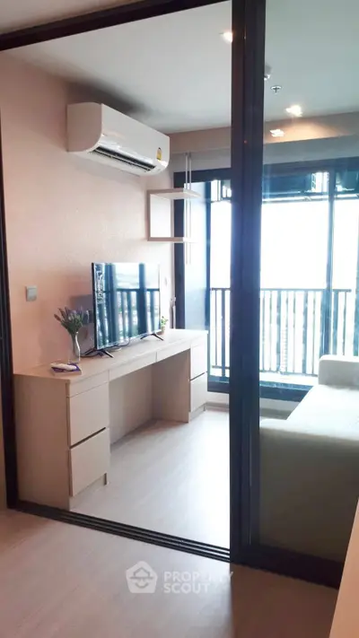 Modern living room with air conditioning and balcony view