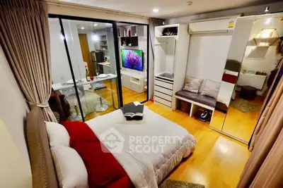 Modern bedroom with mirrored closet and cozy decor in stylish apartment