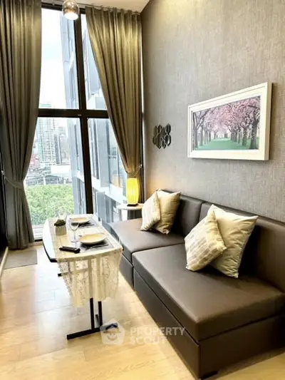 Stylish living room with floor-to-ceiling windows and city view.