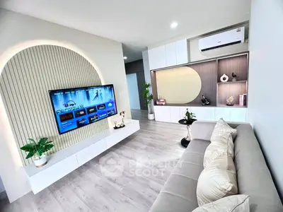 Modern living room with stylish decor and wall-mounted TV