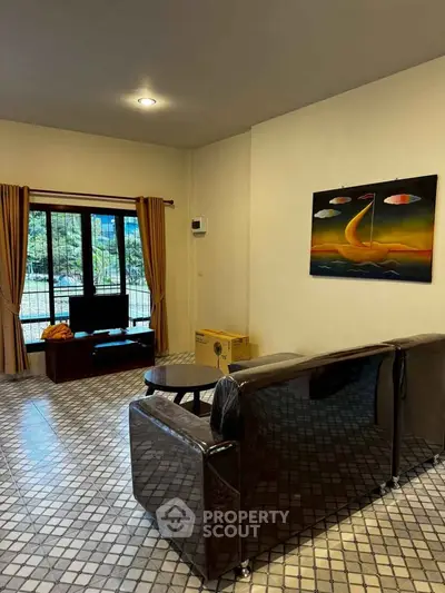 Cozy living room with modern decor and large window view