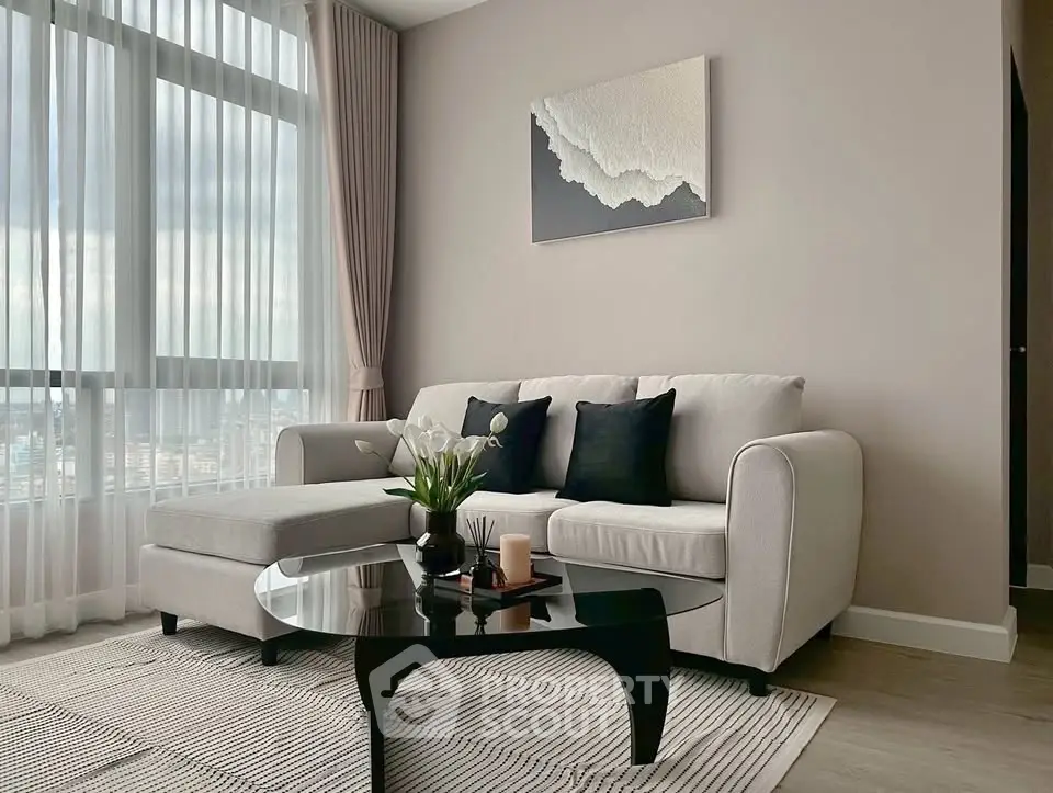 Modern living room with elegant decor and large window view
