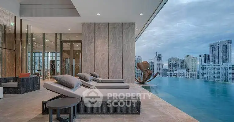 Luxurious rooftop pool with stunning city skyline view and modern lounge chairs.