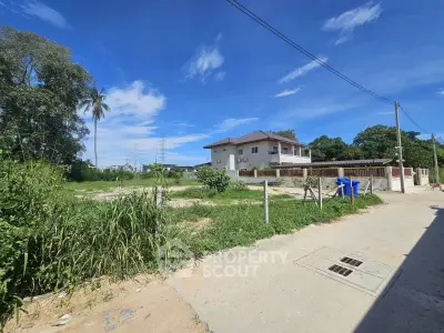 Charming suburban house with spacious yard and clear blue sky, perfect for family living.