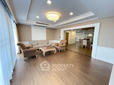 Spacious living room with elegant furniture and open layout, perfect for modern living.
