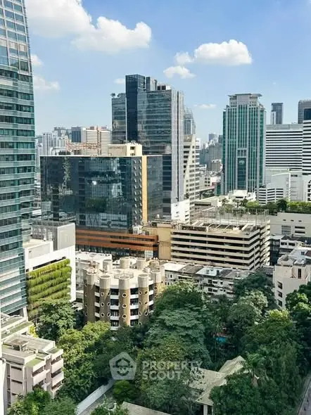 Stunning cityscape view showcasing modern skyscrapers and lush greenery in an urban setting.