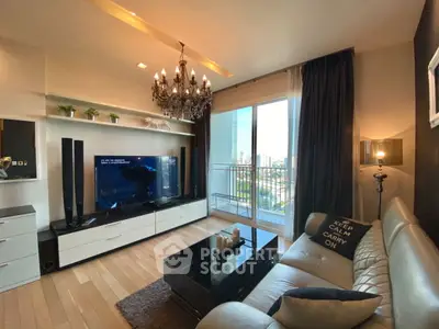 Luxurious living room with chandelier and city view balcony