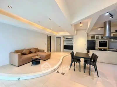 Spacious modern living room with open kitchen and stylish decor