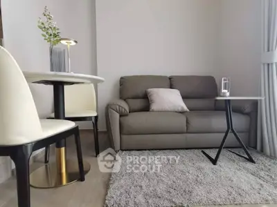 Modern living room with cozy sofa and stylish dining area, perfect for urban living.