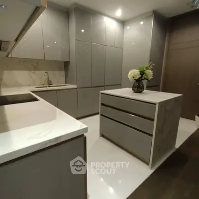 Modern kitchen with sleek cabinets and marble countertops