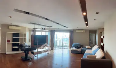 Spacious modern living room with city view and stylish furniture.