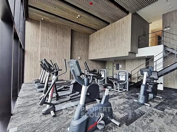 Modern gym with state-of-the-art exercise equipment and stylish interior design.