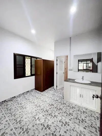Spacious bathroom with modern fixtures and stylish tile flooring