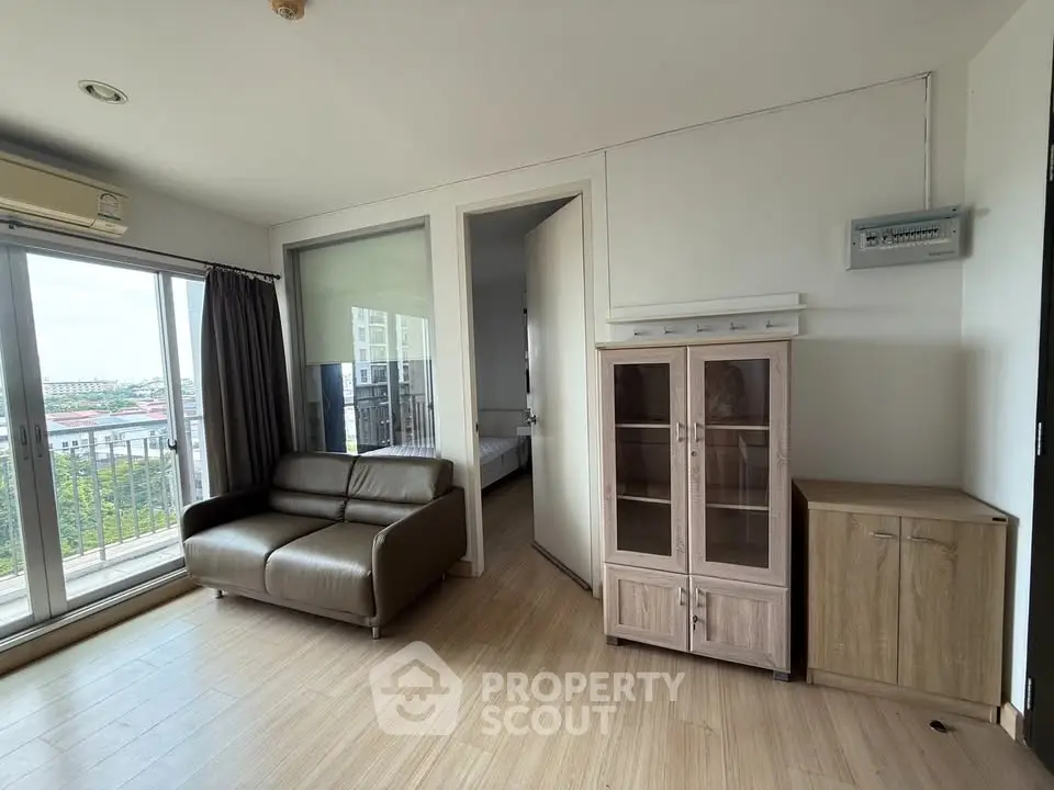 Modern living room with balcony view and stylish furniture