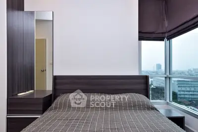 Modern bedroom with city view and sleek furniture design