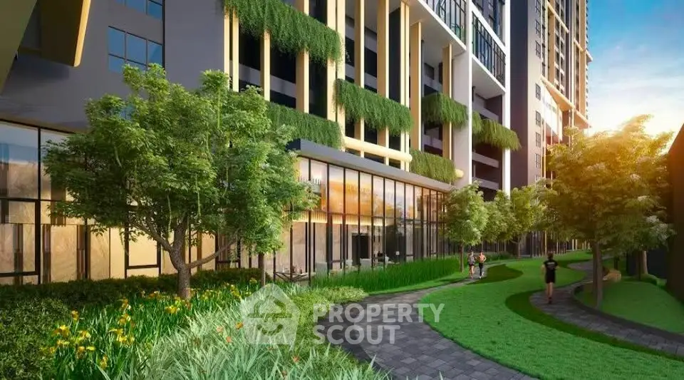 Modern residential building with lush green landscaping and walking paths.