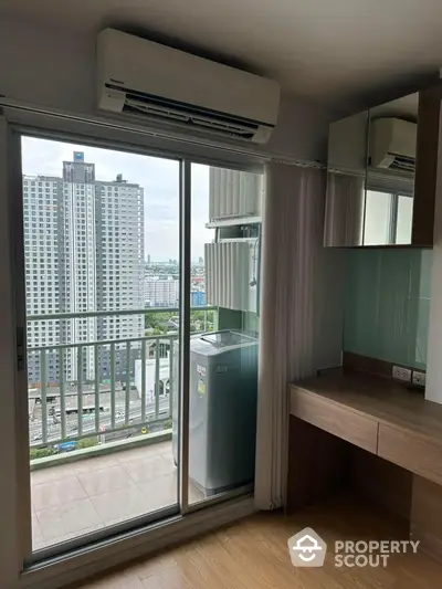 Modern apartment with balcony and city view, featuring air conditioning and washing machine.