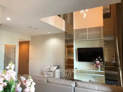 Luxurious modern living room with high ceilings and elegant decor