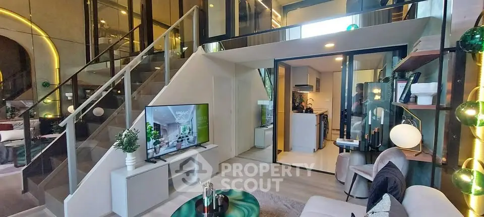 Modern duplex living room with stylish decor and open kitchen layout