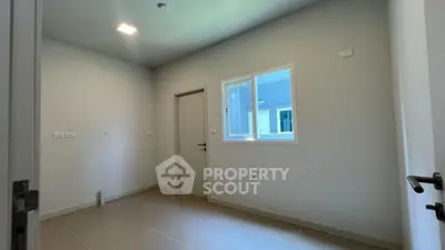 Spacious empty room with window and door, ideal for customization