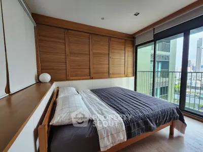 Spacious bedroom with modern design and city view balcony