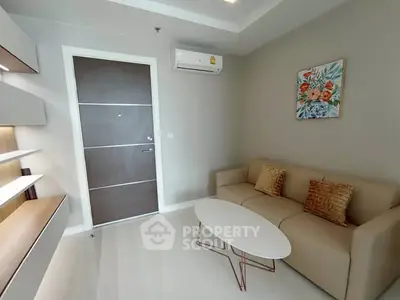 Modern living room with sleek design and cozy seating area