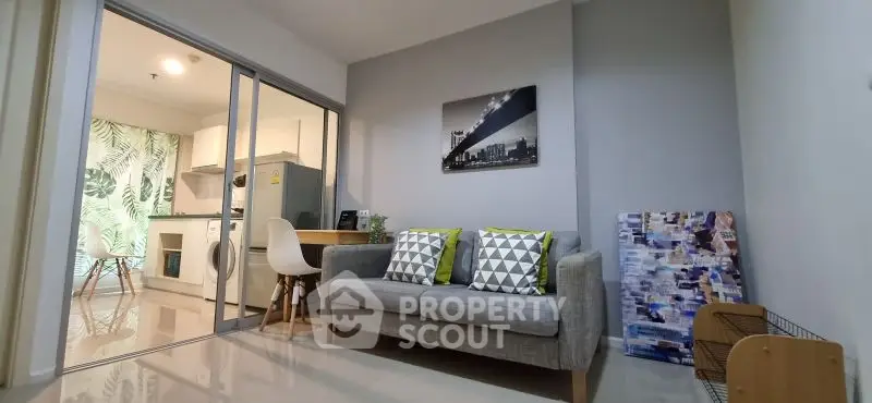 Modern living room with stylish decor and open kitchen layout
