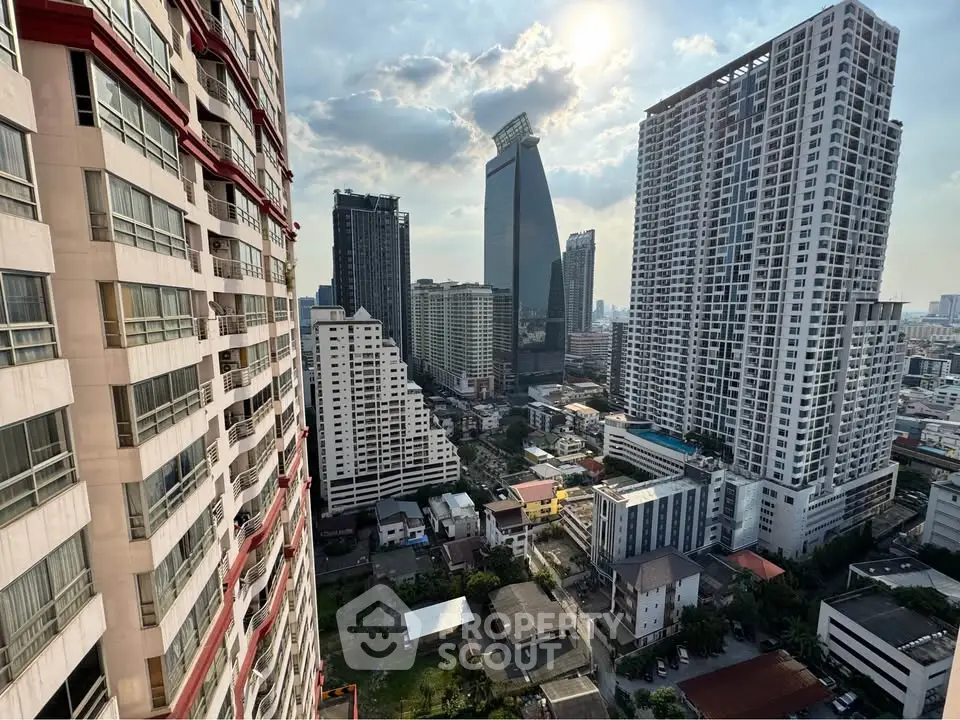 Stunning cityscape view from a high-rise balcony showcasing modern skyscrapers and urban landscape.