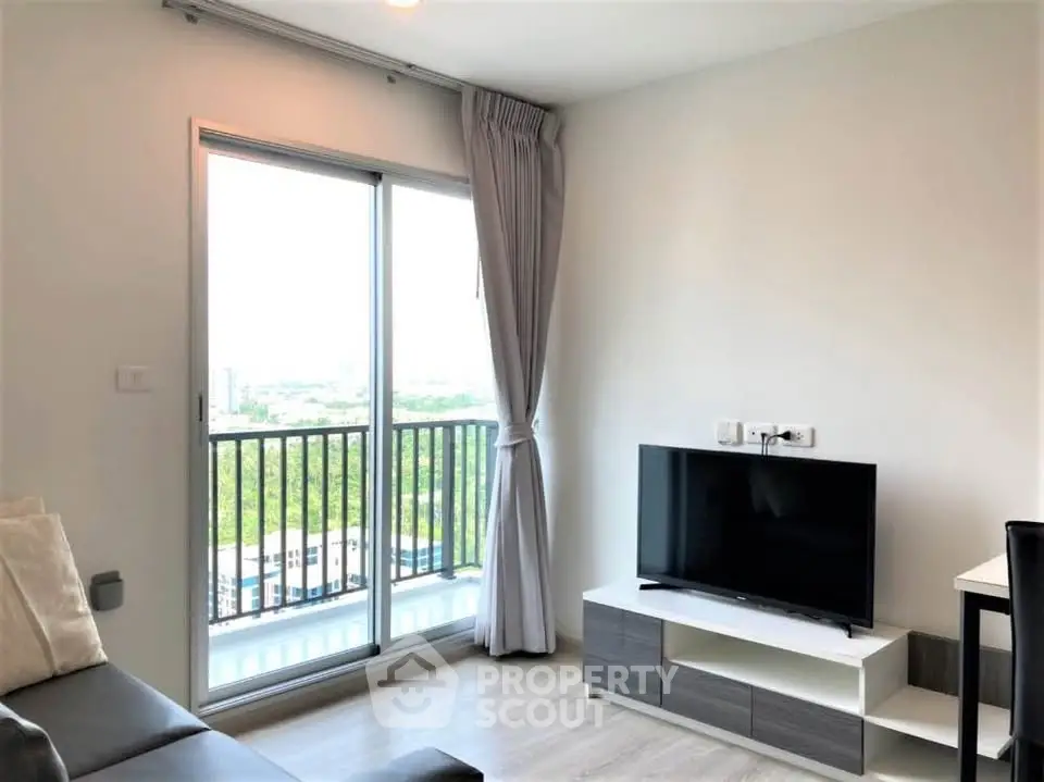 Modern living room with balcony view in high-rise apartment