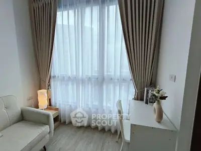 Cozy study nook with elegant curtains and natural light in modern apartment