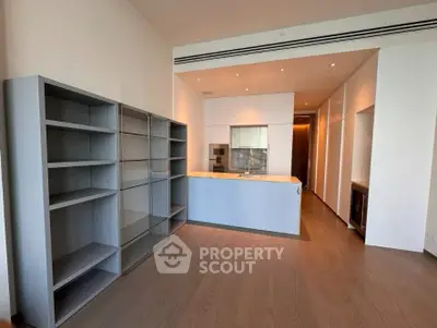 Modern kitchen with sleek cabinetry and open layout in luxury apartment