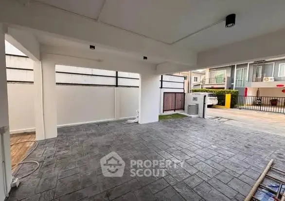 Spacious covered parking area with modern design and tiled flooring