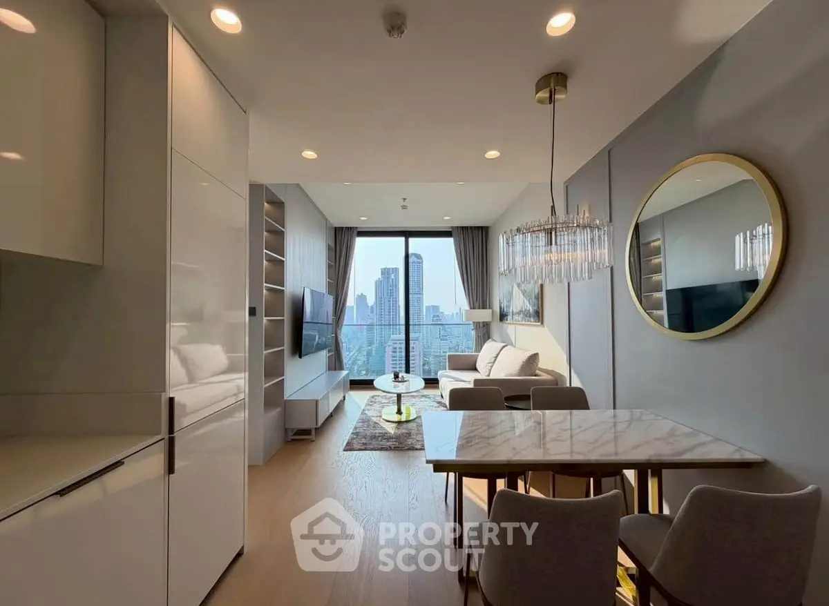 Modern living room with city view, elegant decor, and stylish furniture.