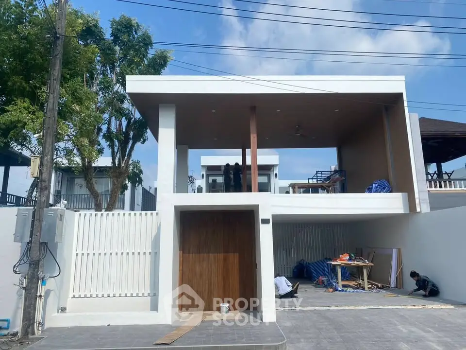 Modern two-story house with sleek design and spacious outdoor area