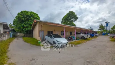 Charming rural property with ample parking and lush greenery, ideal for serene living.