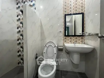 Modern bathroom with stylish tile accents and sleek fixtures