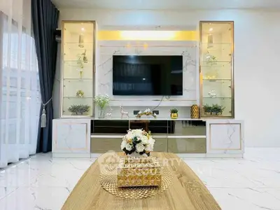 Luxurious modern living room with elegant decor and large TV display