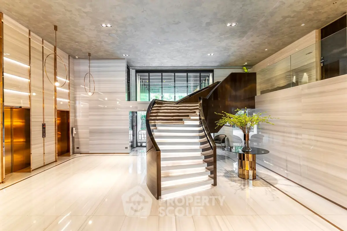 Luxurious building entrance with elegant staircase and modern design