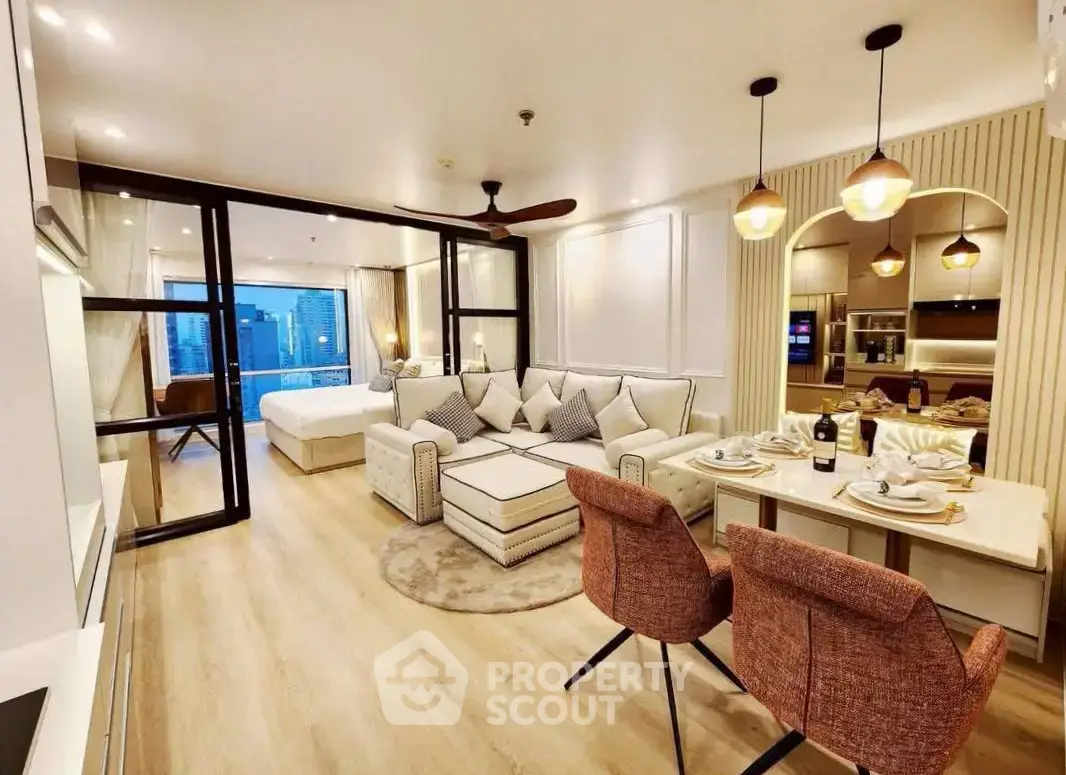 Luxurious open-plan living room with modern kitchen and city view, perfect for urban living.