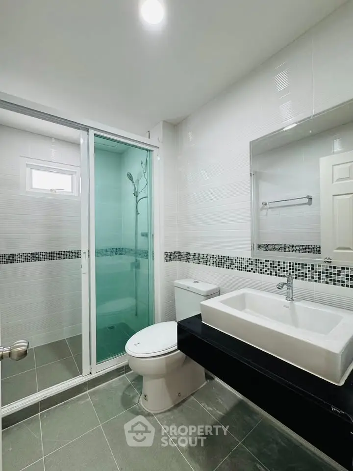 Modern bathroom with sleek design and glass shower enclosure