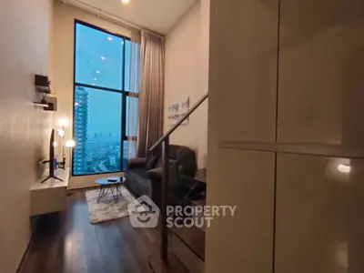 Modern loft-style living room with city view and high ceilings