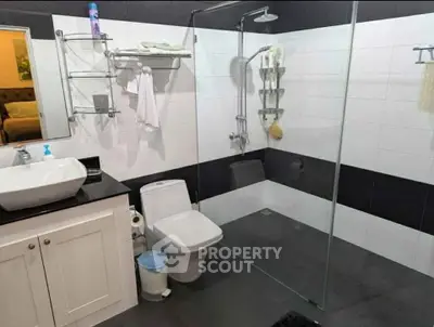 Modern bathroom with sleek glass shower and stylish fixtures