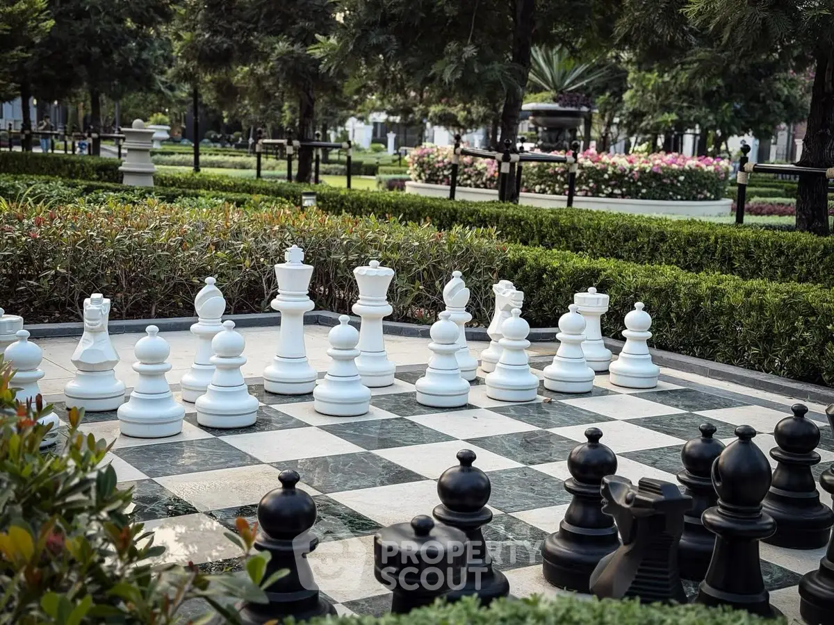 Luxurious garden with giant chess set in upscale residential area