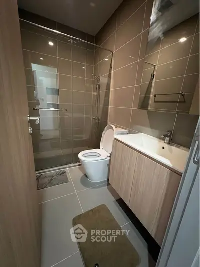 Modern bathroom with sleek design and glass shower enclosure