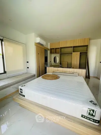 Modern bedroom with stylish wooden accents and natural light
