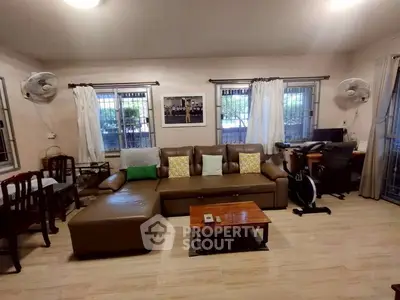 Spacious living room with modern furniture and natural light