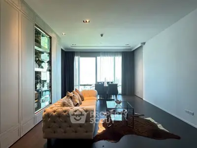 Luxurious living room with plush sofa and elegant decor, featuring a spacious layout and natural light.