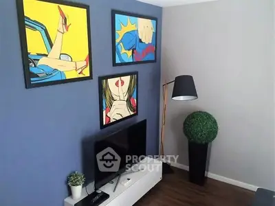 Stylish living room with pop art decor and modern furnishings.