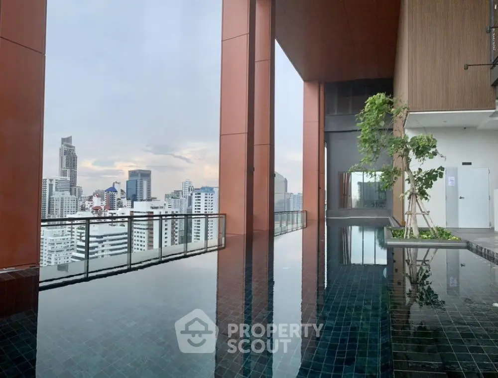 Stunning rooftop pool with panoramic city views and modern architecture.